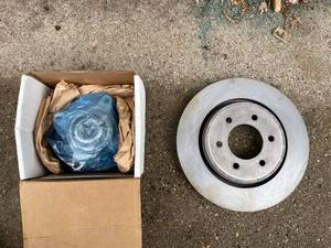lot 95 image: Used Brake Rotor with New Wheel Hub Assembly Component
