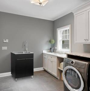 lot 53 image: Presenza W24.1 in. X D21.3 in. X H33.8 in. Large Stainless Steel Utility Sink with Pull-Down Faucet and Storage Cabinet in Matte Black - Retail $578