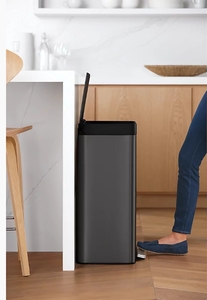 lot 81 image: KOHLER 20940-BST 13 Gallon Kitchen Step Trash Can with Foot Pedal, Soft Close Lid, Black Stainless Steel - Minor Dent
