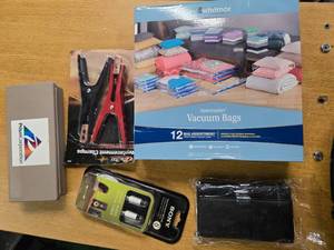 lot 41 image: Lot of 5 items ( Vacuum Bag, Replacement Clamps, Sony digital Audio optical Care, a Wallet, and a Prism Corporation)