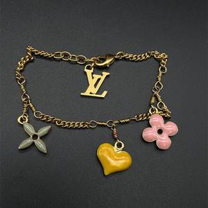 lot 25 image: Louis Vuitton Dangling LV Enamel Charm Bracelet
