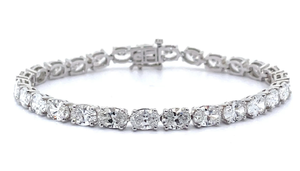 lot 2 image: Sparkling 13.50 Carat Oval Diamond Tennis Bracelet in 18k White Gold $17,600 Retail VIDEO