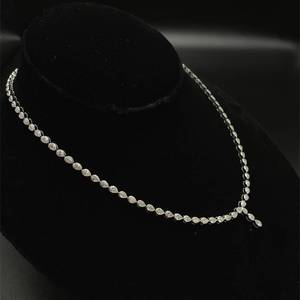 lot 11 image: 10 Carat Pear-Shaped Diamond Bezel Tennis Chain Y-Necklace in 14k Yellow Gold