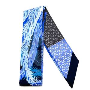 lot 29B image: Herms Blue Feather & Horseshoe Twilly Scarf