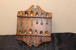 lot 125 image: Collection of 13 Vintage Souvenir Spoons Displayed on Wall Rack