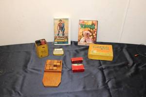 lot 131 image: Collection of Vintage Games and Movies including Tiddledy Winks, Mayfair Tea Can, and Two VHS Tapes