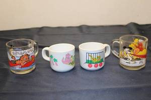 lot 228 image: Set of 4 Vintage Cartoon Character Cups - Garfield, Dino, and McDonalds