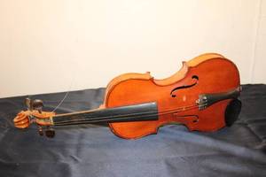lot 229 image: Antique Violin with Unique Features and Visible Wear