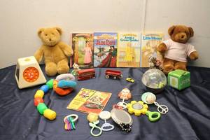 lot 276 image: Collection of Vintage Toys and Books Including Stuffed Animals, Rattles, and a Clown Mirror