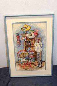 lot 300 image: Framed Cross-Stitch Artwork featuring Vintage Decor and Toys