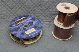 lot 20 image: Set of 4 Kirkland Wired Edge Ribbon Rolls - Holiday Collection