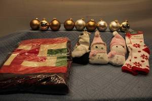 lot 91 image: Christmas Themed Blanket, Plush Socks, and Ornaments Set