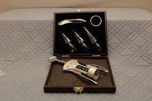 lot 100 image: Stainless Steel Wine Accessory Set in Brown Gift Box