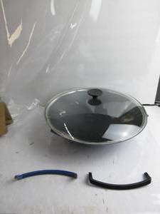 lot 75 image: Le Creuset Enameled Cast-Iron 14-14-Inch Wok with Glass Lid, Cobalt Blue BOTH HANDLES ARE BROKEN, LID IS BENT INSIDE, CLOSES BUT A BIT WOBBLY, NEW