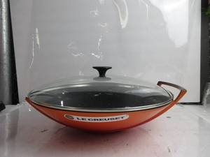 lot 78 image: Le Creuset Enameled Cast-Iron 14-14-Inch Wok with Glass Lid, Flame MISSING 1 HANDLE, BROKEN HANDLE, LID A BIT BENT INSIDE, LID CLOSES, NO BOX,  NEW