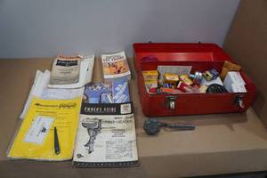 lot 6 image: Metal Tool Box with Assorted Manuals and Small Engine Parts