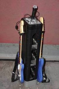 lot 167 image: Gaming Stand for Wii with Rock Band Guitars