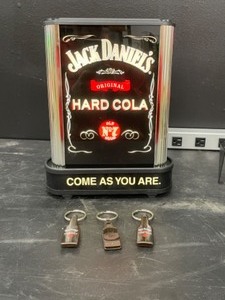 lot 72 image: Jack Daniels Hard Cola bracket mounted light up, with 3 keychain bottle openers