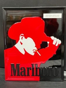 lot 164 image: Marlboro Man red and black graphic tin tacker,
