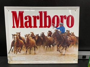 lot 165 image: Marlboro Man  Cowboy herding horses, tin tacker
