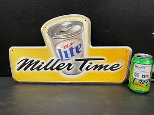 lot 174 image: Miller Time beer can tin tacker, tin sign