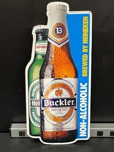 lot 175 image: Buckler NA Malt beverage, brewed by Heineken, tin tacker