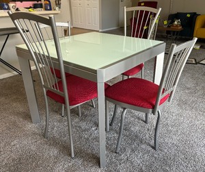 lot 1 image: Calligaris Dining Table with Four Chairs
