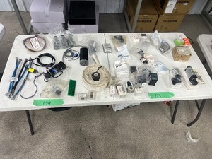 lot 199 image: TABLE FULL OF WOODWORKING MACHINERY COMPONENTS