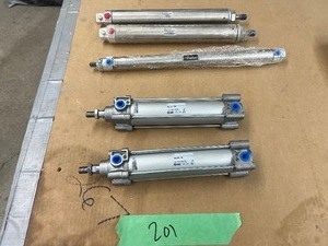 lot 201 image: 2) SMC, 1) PARKER, & 2) NORGREN ACTUATORS