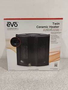 lot 77 image: NEW EVO TWIN CERAMIC HEATER WITH HEAT LOGIC TECHNOLOGY