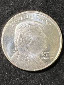 lot 23 image: 1 TROY OZ .999 FINE SILVER DONALD TRUMP ROUND