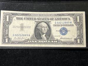 lot 101 image: 1957 US BLUE SEAL $1 SILVER CERTIFICATE