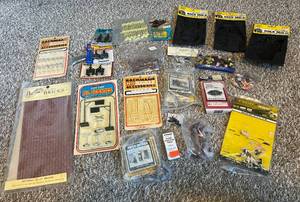 lot 128 image: HUGE LOT of New Old Stock HO Scale Accessories - Animals, Signage, Rock Mold, Freight Tracks, Tires, Outhouses, Bricks, and More
