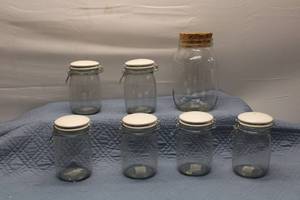 Set of 6 Glass Storage Jars with Lids and 1 Large Jar