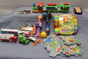 Assorted Kids Toys Including Musical Rhymes Book, Trains, and Action Figures