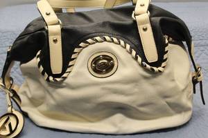 Stylish Black and Cream Handbag with Signature Logo Tag
