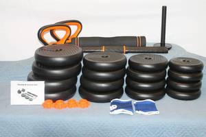lot 1 image: Adjustable Dumbbell Set with Kettlebell Handle - 70 lbs Total Weight