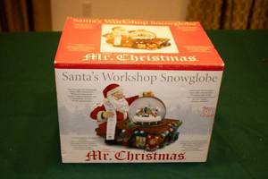 lot 12 image: Mr. Christmas Santas Workshop Snowglobe with Train and Music