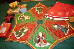 lot 15 image: Christmas Decorations Lot - Tree Skirt, Leaf Ornaments, and Star Toppers