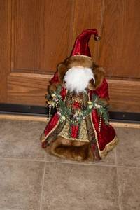 lot 23 image: Decorative Holiday Santa Figurine with Faux Fur and Garland