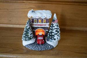 lot 32 image: Light-Up Christmas Fire Station Figurine with Snowy Decor
