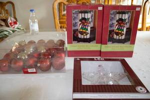 lot 163 image: Collection of Holiday Decorations Tiffany Bell Uplights, LED Tree Topper, and Red Ornaments