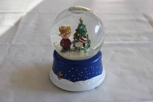lot 69 image: Peanuts Holiday Snow Globe Featuring Charlie Brown and Christmas Tree