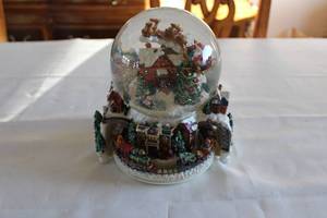 lot 76 image: Christmas Themed Snow Globe Featuring Santa Claus with Village Scene