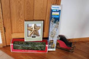 lot 143 image: Christmas Decoration Lot 9ft Lighted Garland, Gold Star Tree Topper, LED Branch Stakes, Decorative Sleigh