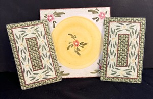 lot 160 image: Three Decorative Trivets