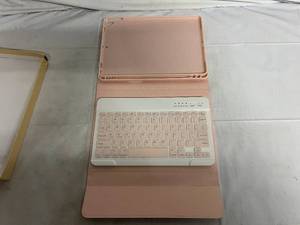 lot 61 image: Pink iPad Case with Removeable Keyboard