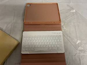 lot 62 image: Pink iPad Case with Removeable Keyboard