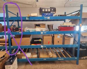 lot 22 image: This is for a pallet tier drop metal racking with box glides slides - missing 1 side uprights circled in picture - Like New