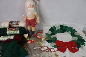 lot 390 image: Holiday Christmas ProjectsWreath Pillow Cover Wall Art, NOS Santa Body with Crocheted Clothing Project, Yarn, Glasses Etc.